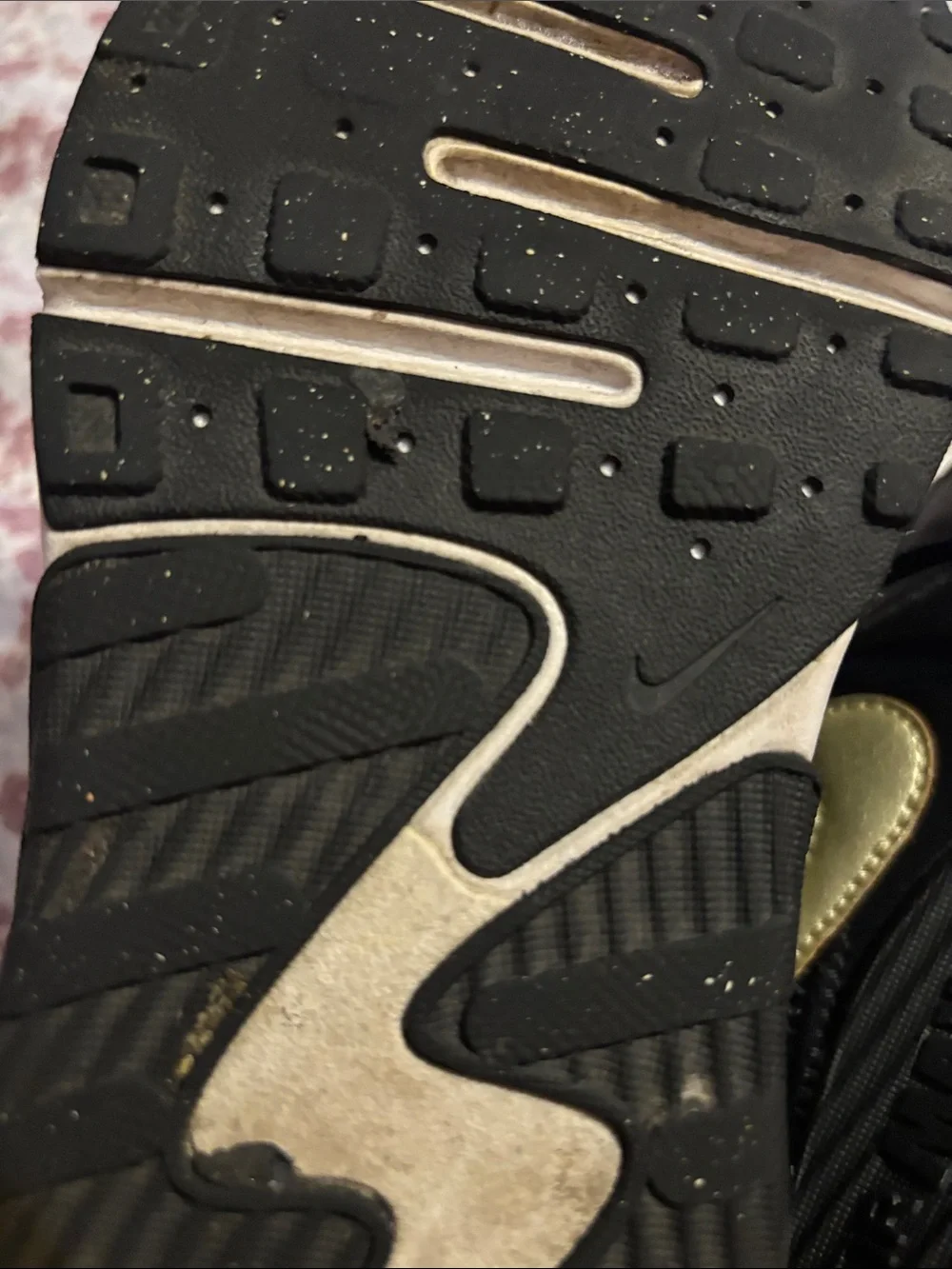 Nike Women's Black Sneakers with Subtle Gold Accent